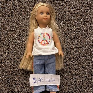 American Girl Doll with Peace Sign Shirt and Blonde Hair